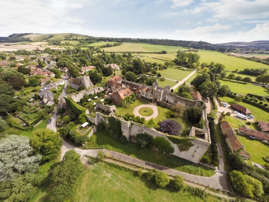 Aerial view of Amberley Castle surrounded by lush countryside, showcasing its historic architecture and scenic landscape.