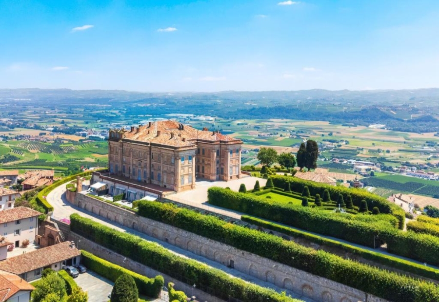 Panoramic view of Castello di Guarene, showcasing the castle and surrounding countryside from a hilltop perspective.